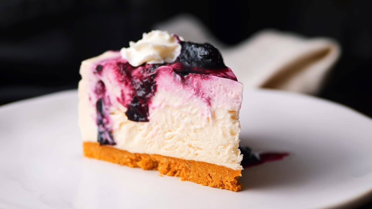 a piece of blueberry cheesecake on a plate