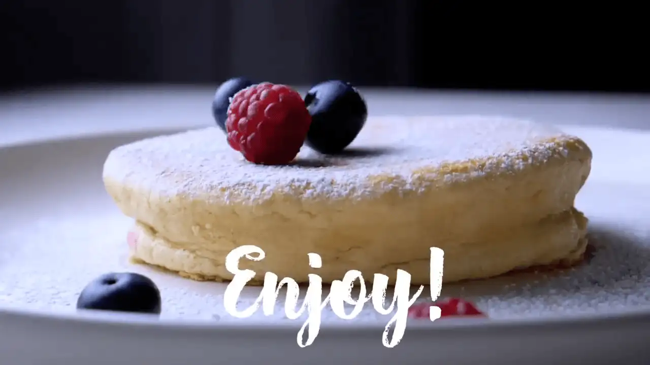 Japanese Souffle Pancakes on a serving plate with some berries