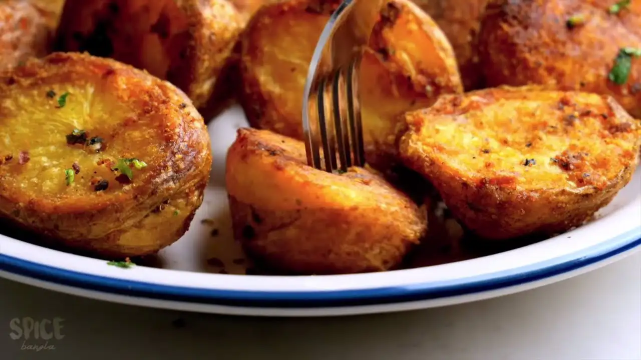 Roasted Potatoes in a serving bowl with a fork