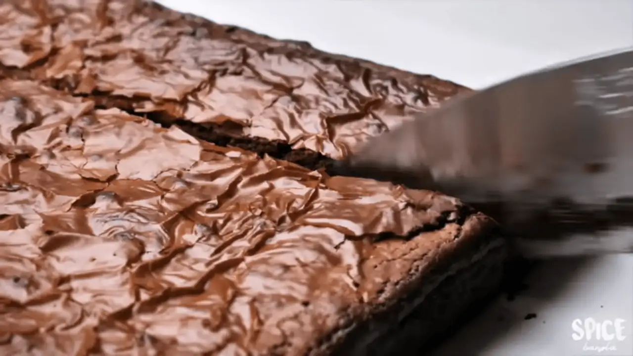 The Best Fudgy Brownie Recipe with a knife