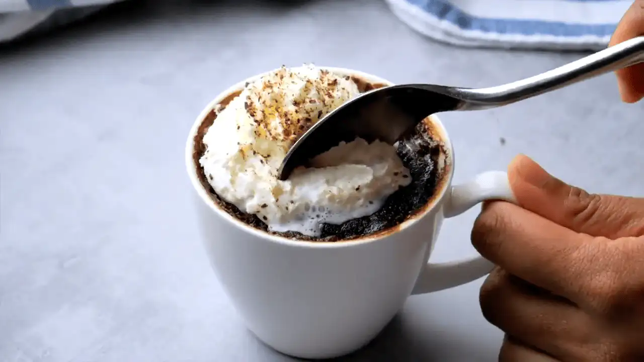 microwave brownie in a mug with a spoon