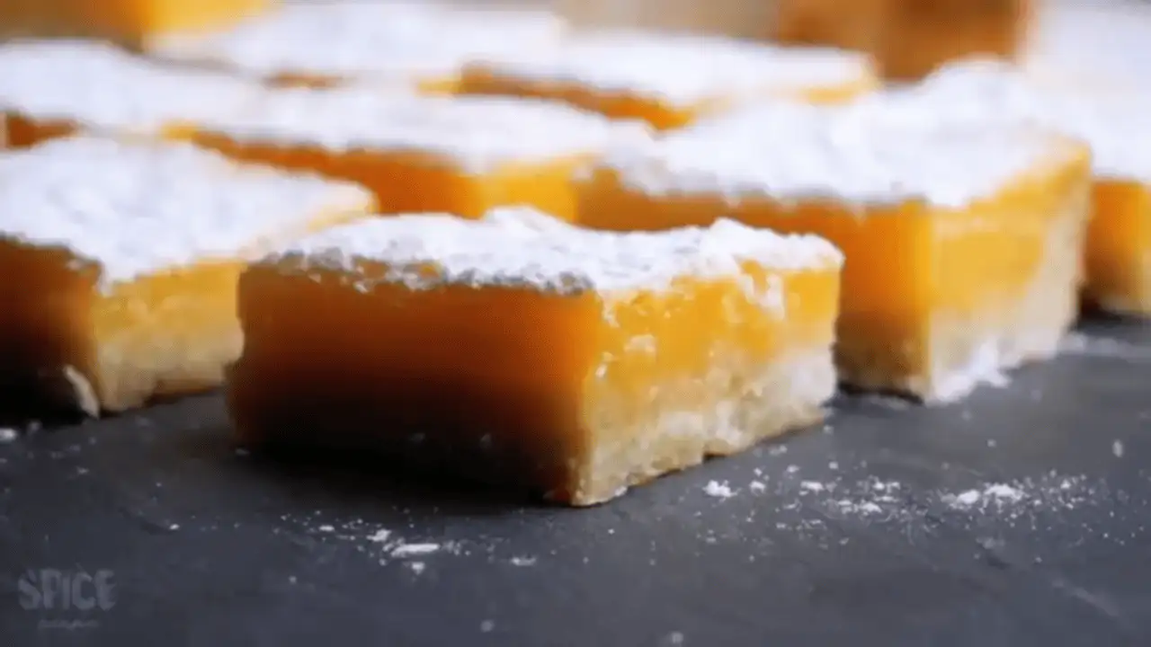 Lemon Bars or lemon tarts on a serving board