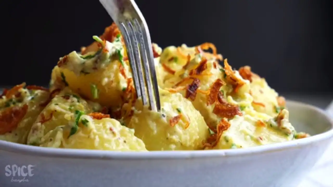 potato salad recipe in a serving bowl with a fork