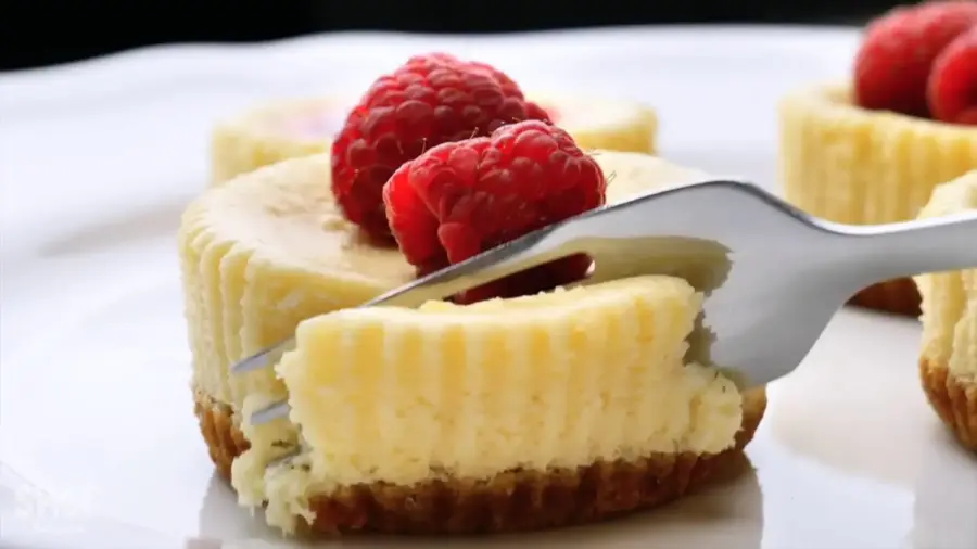 Mini Cheesecake Recipe on a serving plate with a fork