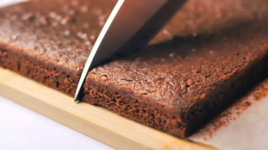 Fudgy Nutella Brownie on a cutting board with a knife