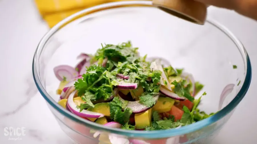 Cucumber Tomato And Avocado Salad in a large mixing bowl