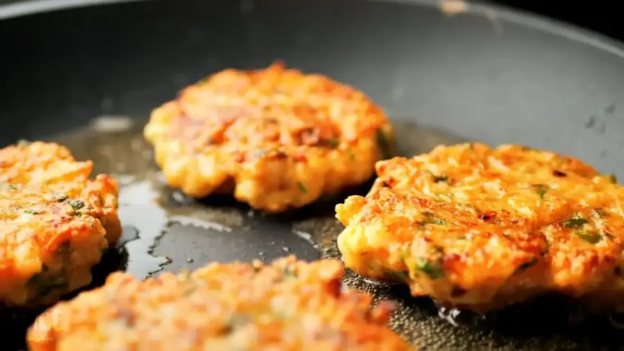 spicy shrimp cakes on a frying pan