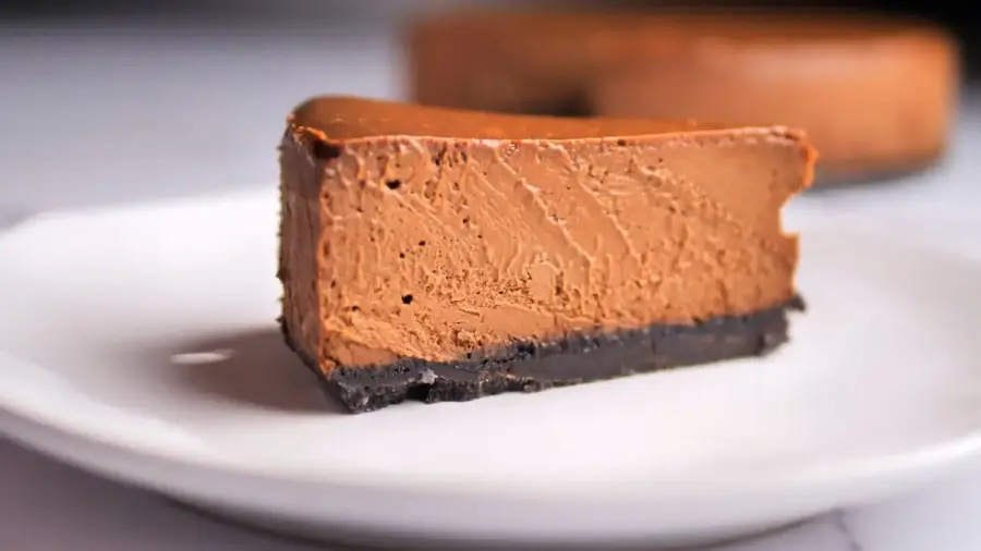 The Ultimate Chocolate Cheesecake serving on a plate