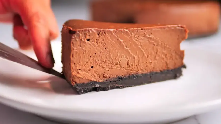 The Ultimate Chocolate Cheesecake serving on a plate