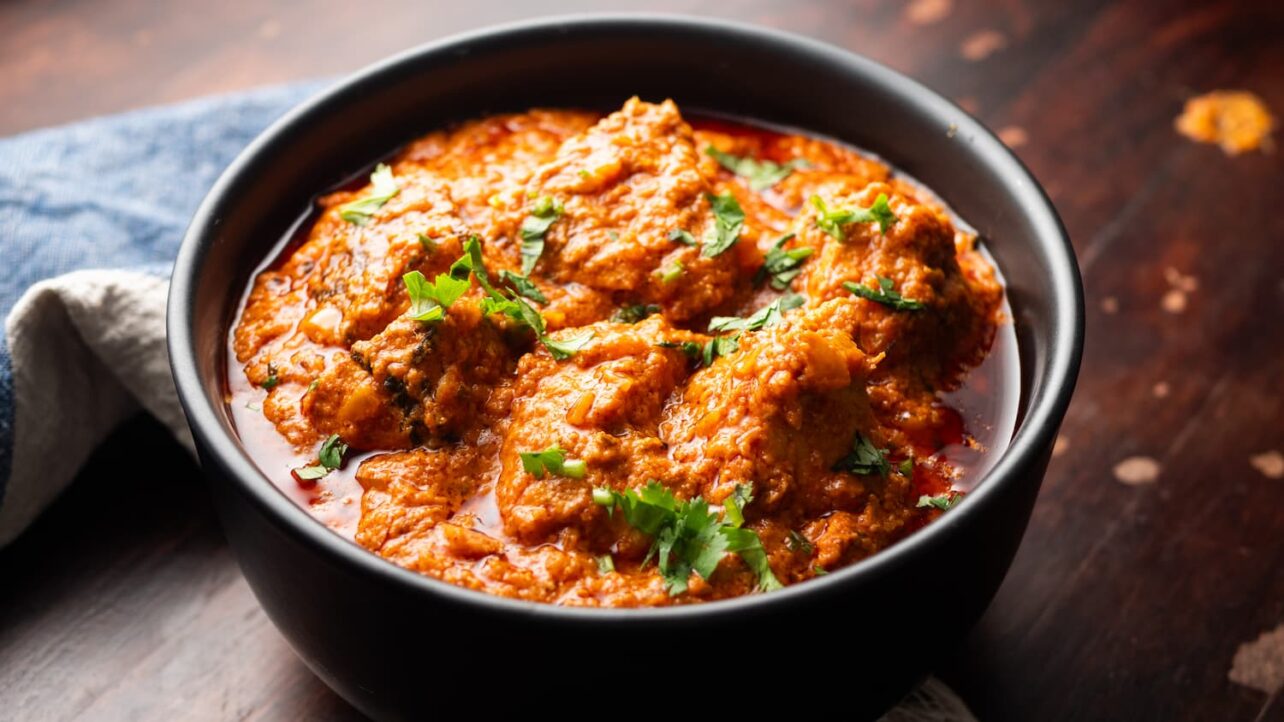 Chicken Tikka Masala in a black bowl