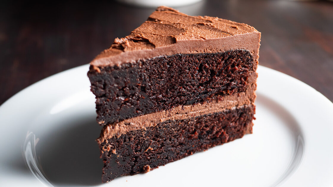 A slice of a chocolate cake on a plate.