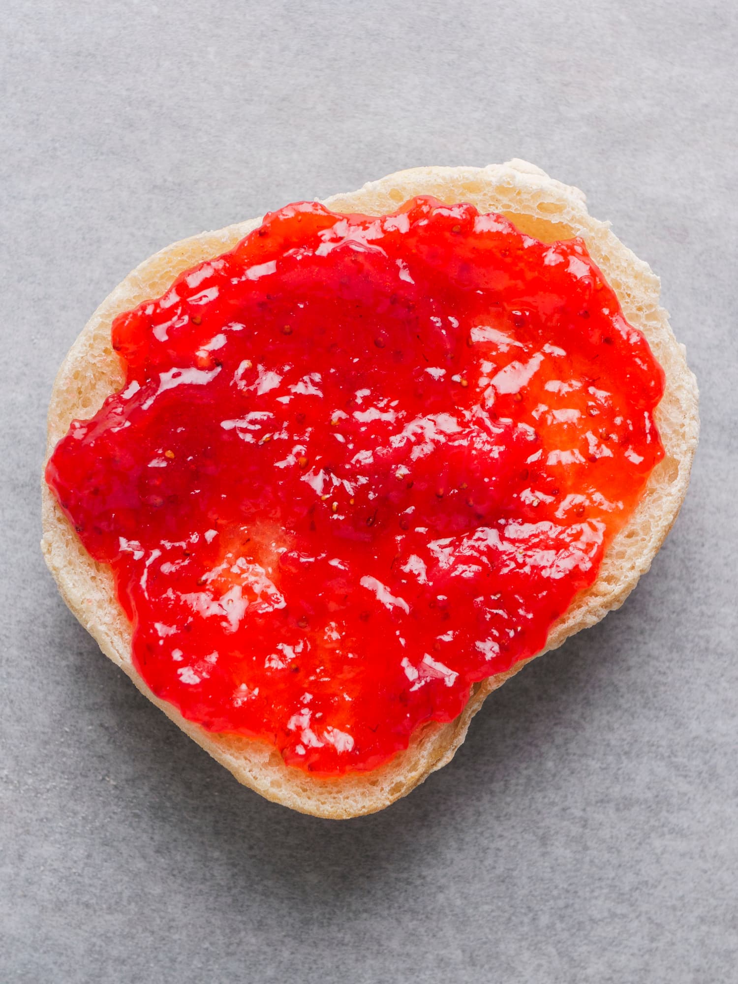 Sure jell Strawberry Jam spread on a bread