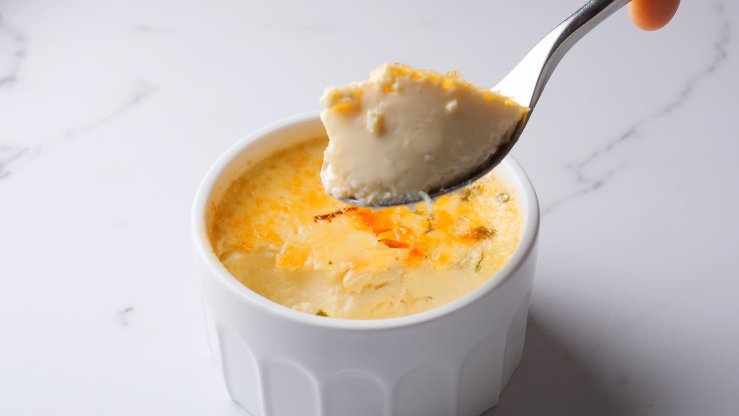 Crab creme brulee in a spoon