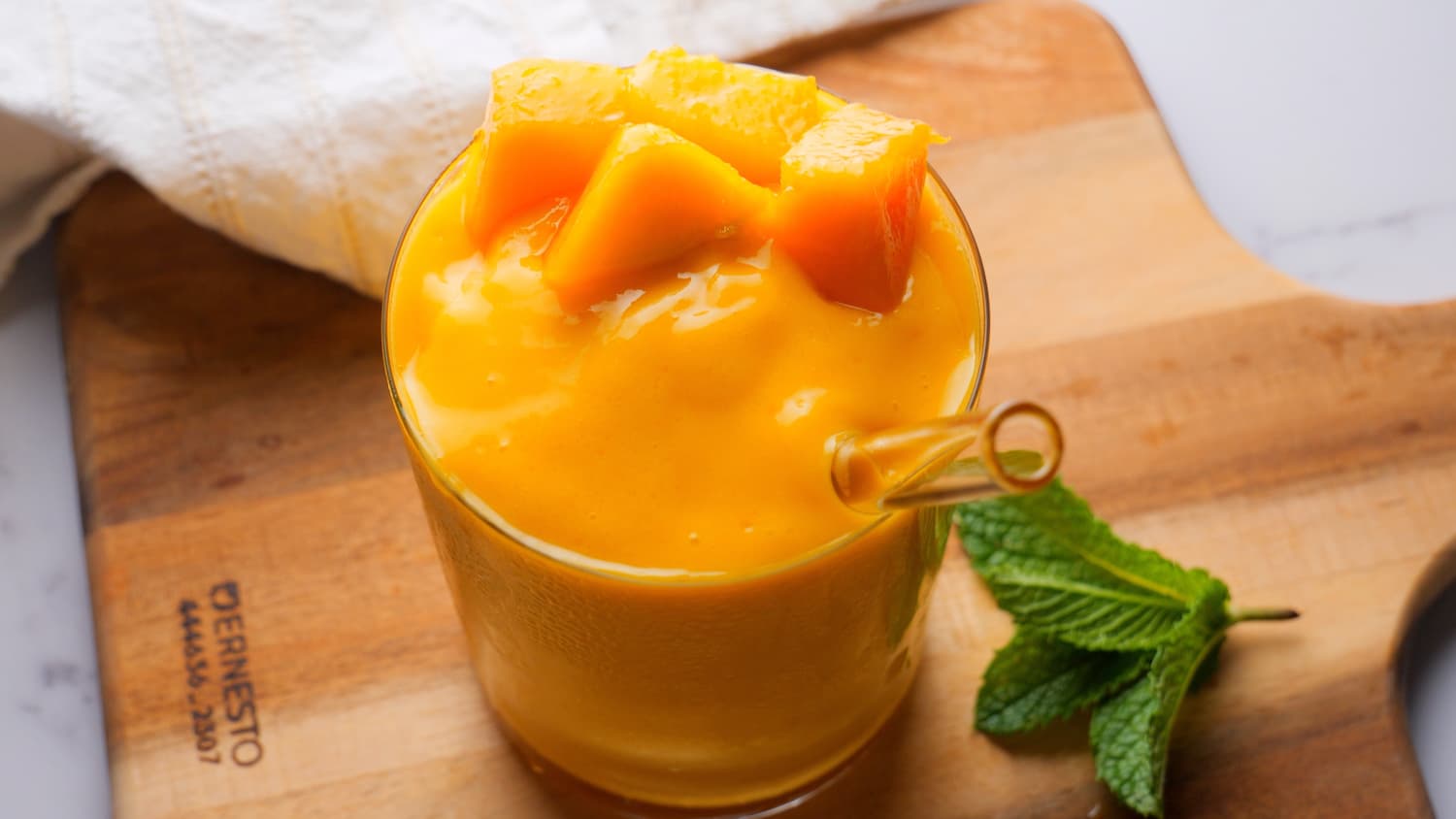 a glass of mango smoothie