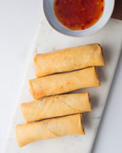 4 piece of Spring Rolls served with sauce