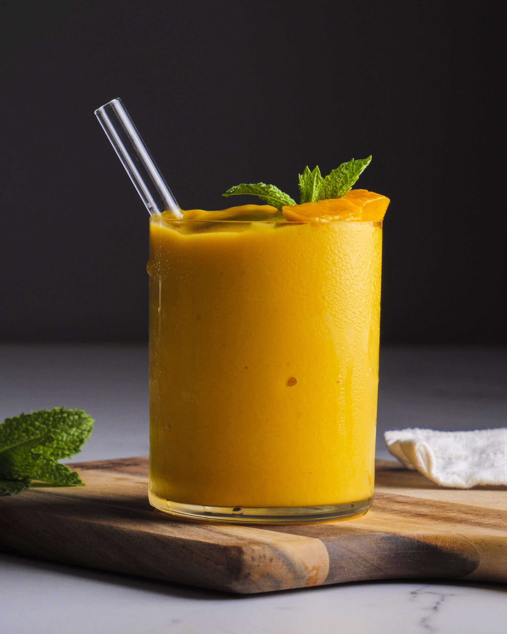 a glass of mango smoothie