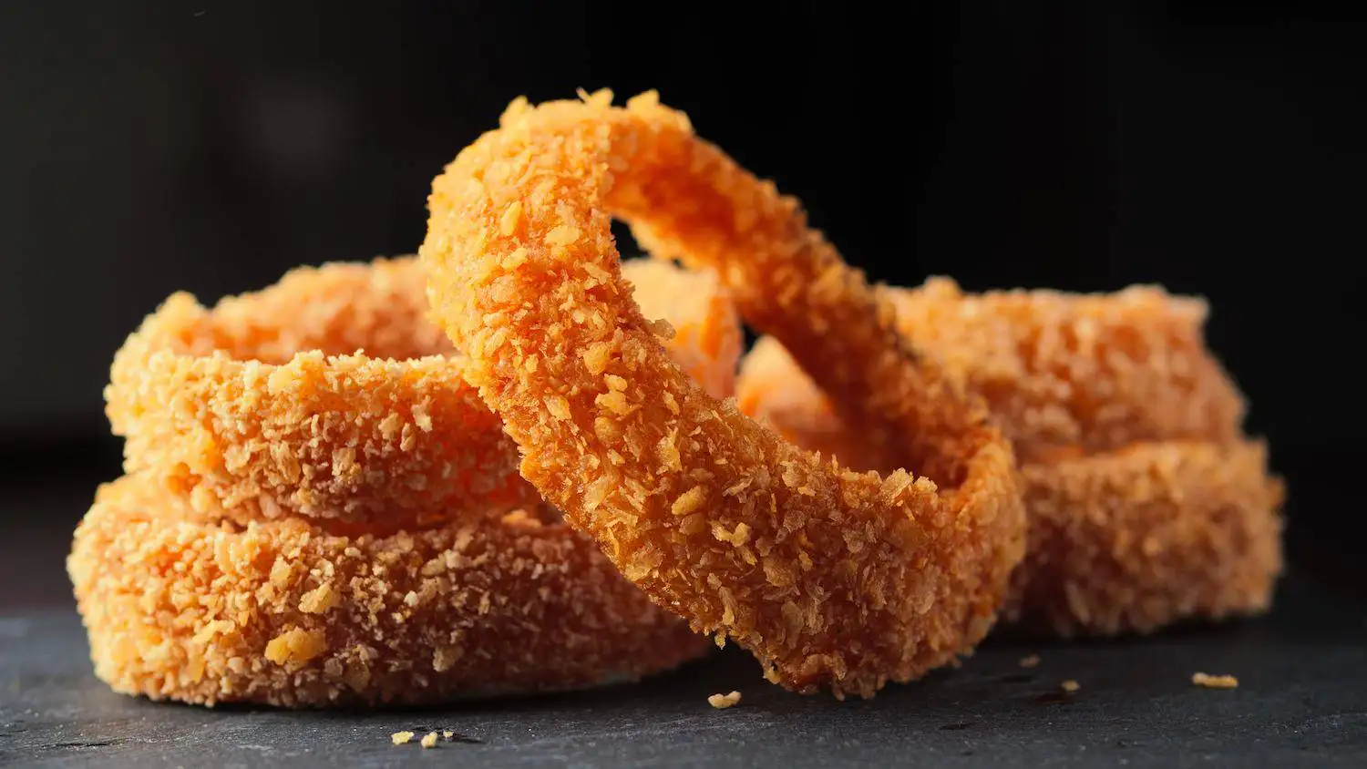 crispy onion rings recipe on a serving plate