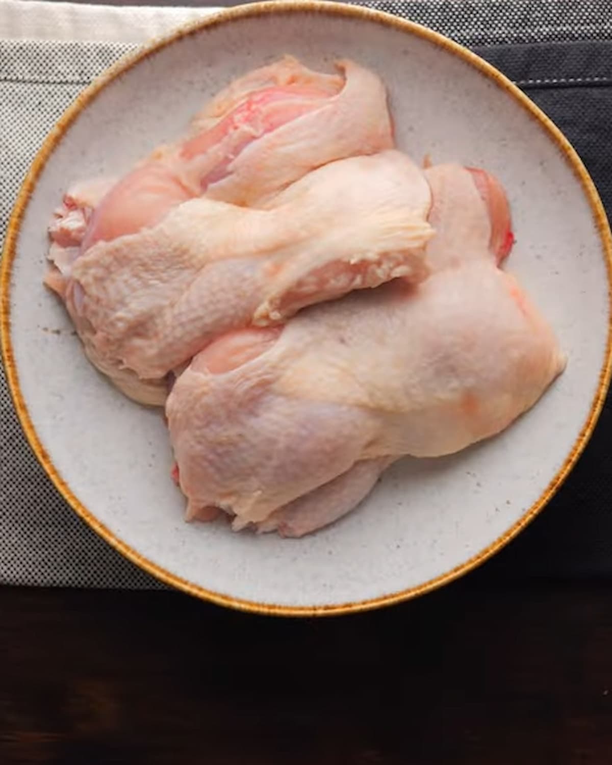 honey garlic chicken recipe's chicken thigh pieces in a bowl