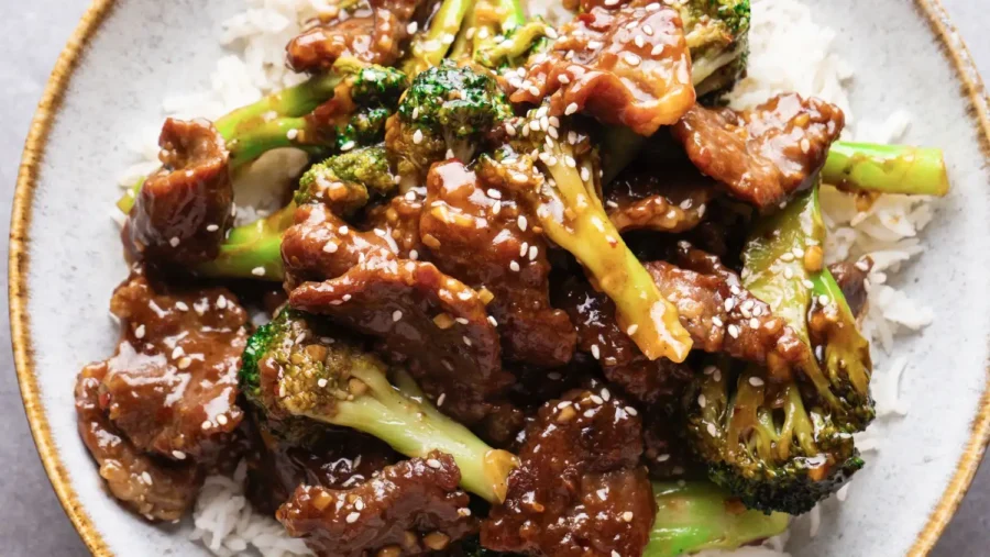 Beef and Broccoli Stir Fry in a serving plate with rice