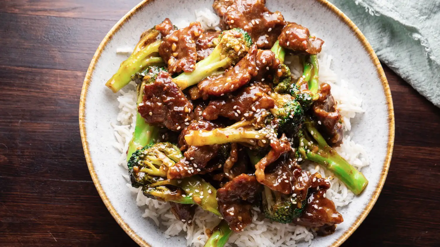 Beef and Broccoli Stir Fry in a serving plate with rice