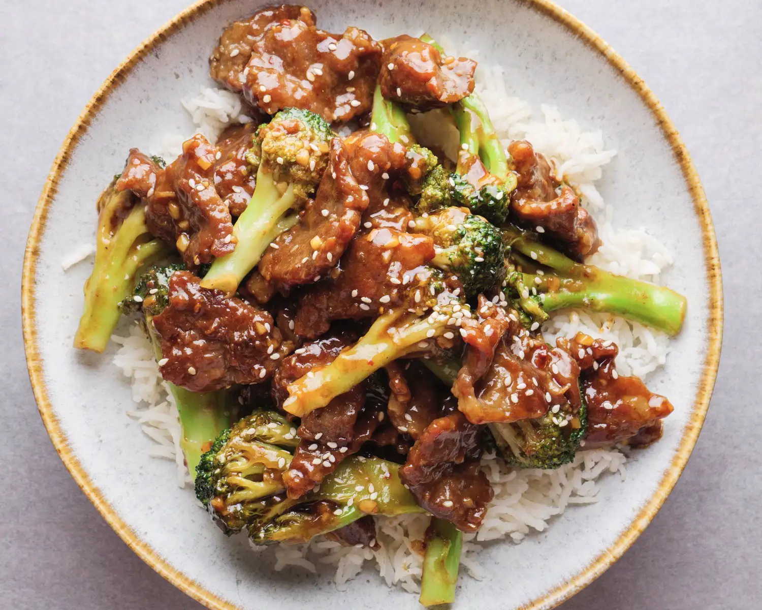 Beef and Broccoli Stir Fry in a serving plate with rice