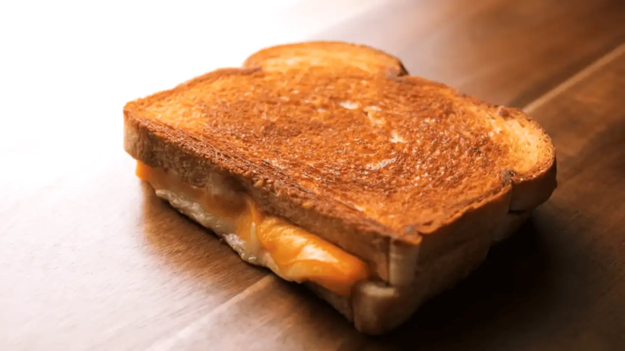 Grilled Cheese Sandwich Recipe placing on a board