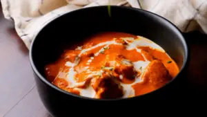 butter chicken recipe on a serving bowl