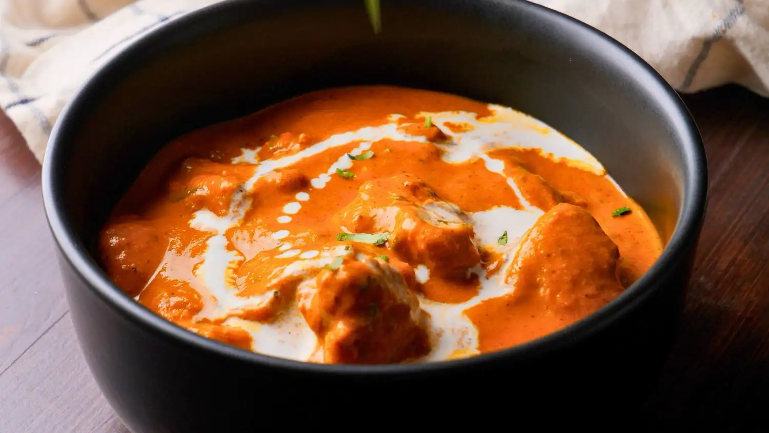 butter chicken recipe on a serving bowl