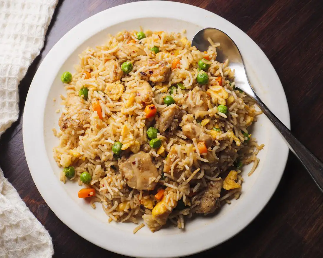 Garlic Chicken Fried Rice on a serving plate with a spoon