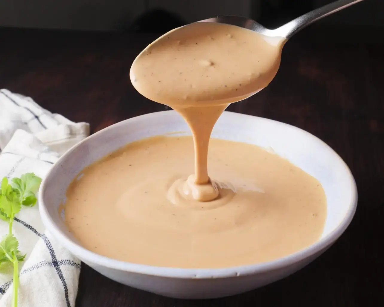 Raising Cane's Sauce Recipe in a bowl with a spoon