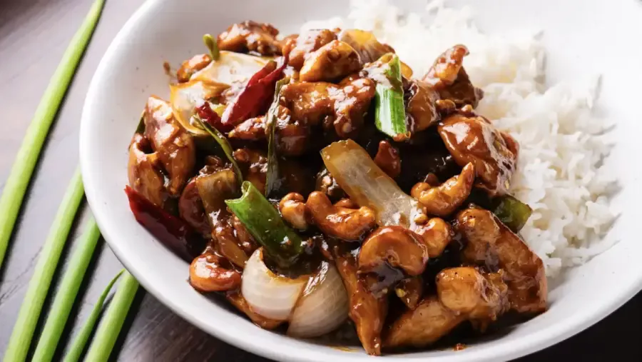 Thai Cashew Chicken with rice on a serving plate