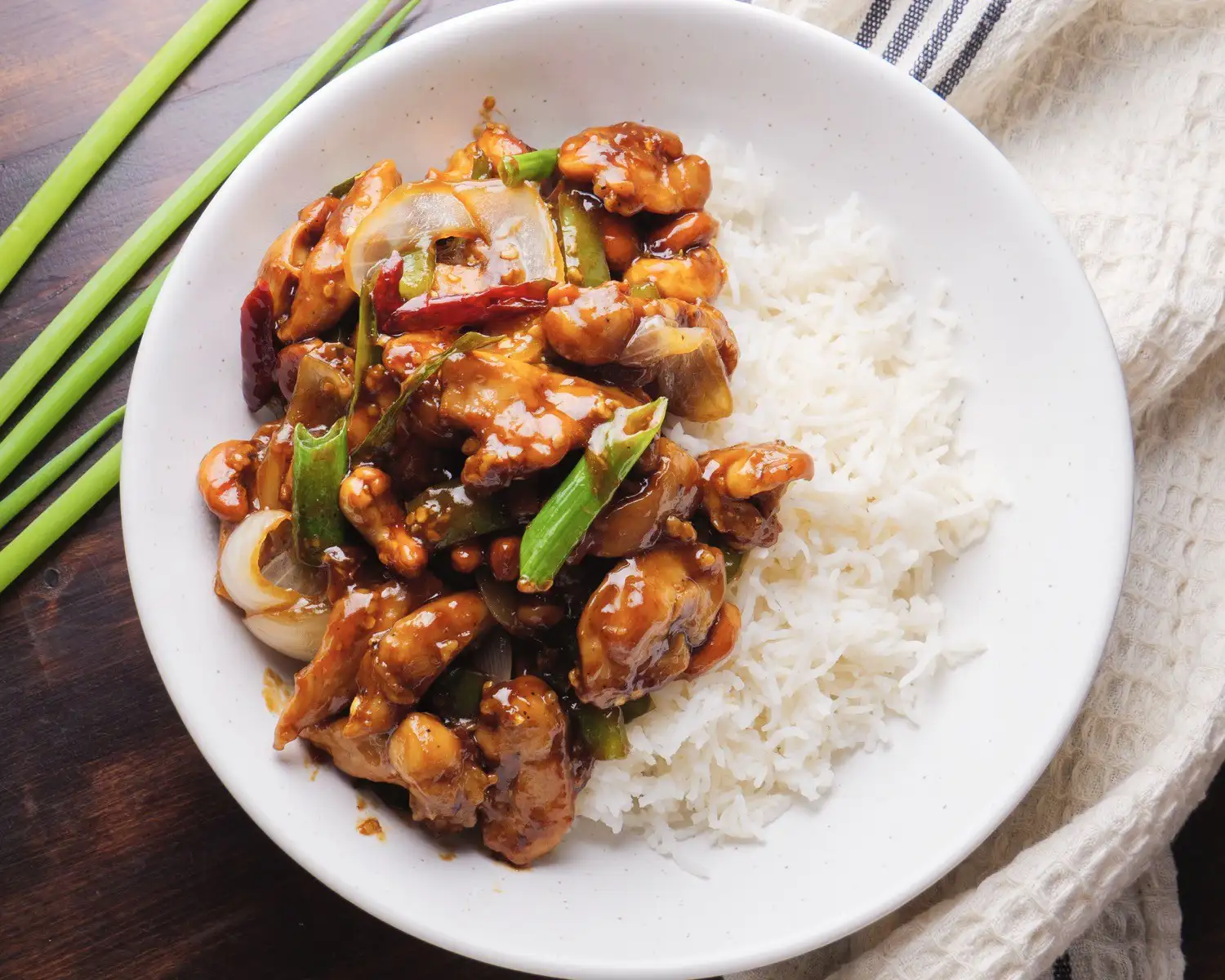 Thai Cashew Chicken with rice on a serving plate