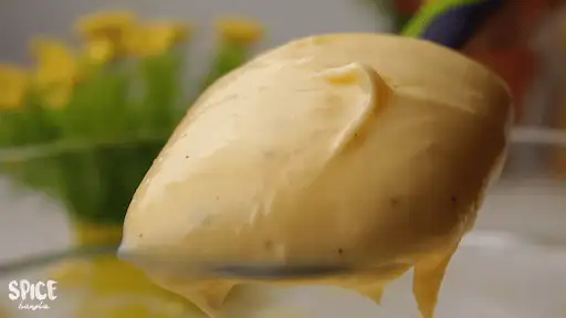 Homemade Mayonnaise Recipe on a spoon