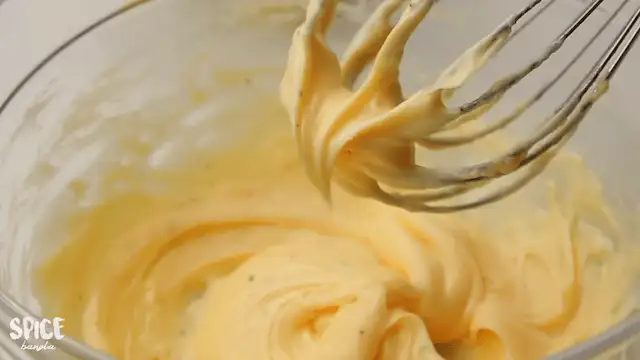 Homemade Mayonnaise Recipe on a mixing bowl with a whisk