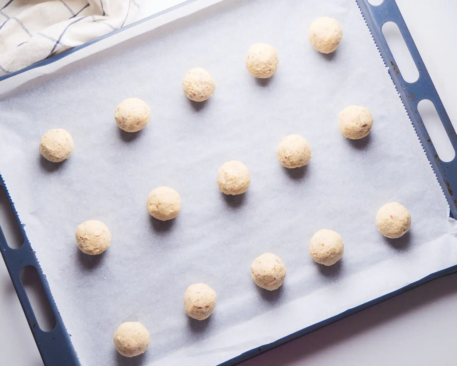 Mexican wedding cookies on a baking tray 