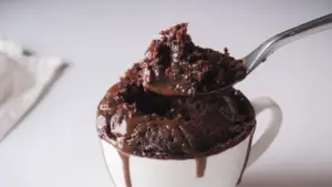 Chocolate Lava Mug Cake in a mug with a spoon