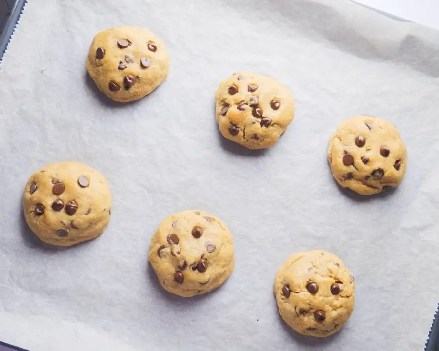 Peanut Butter Chocolate Chip Cookies cooling on a baking sheet/tray