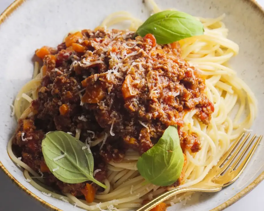 Spaghetti Bolognese Recipe on a serving bowl with a fork
