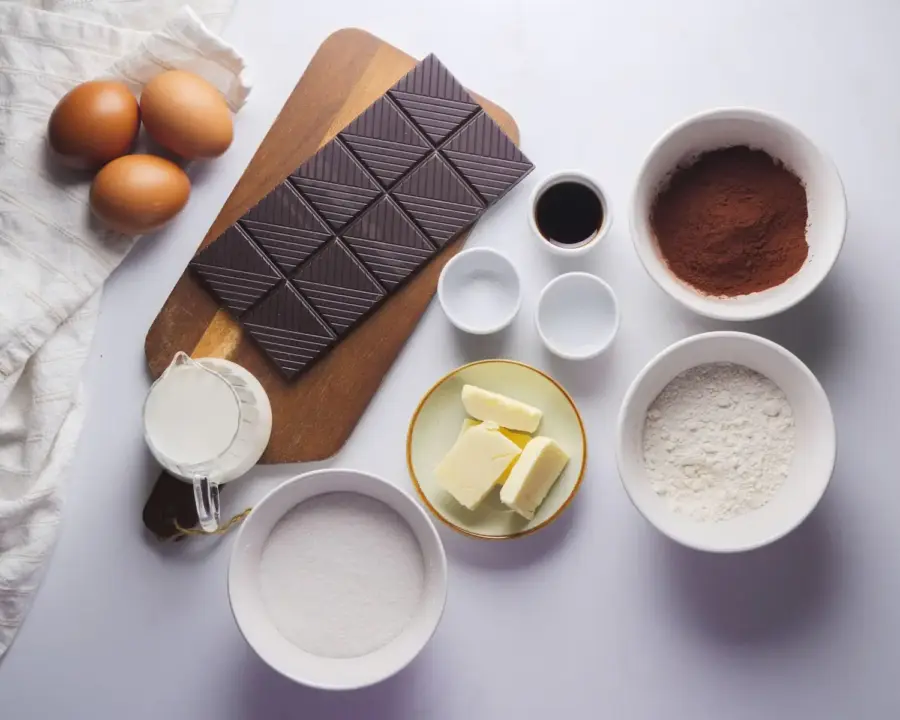 Brownie Cake Recipe Ingredients on a kitchen countertop