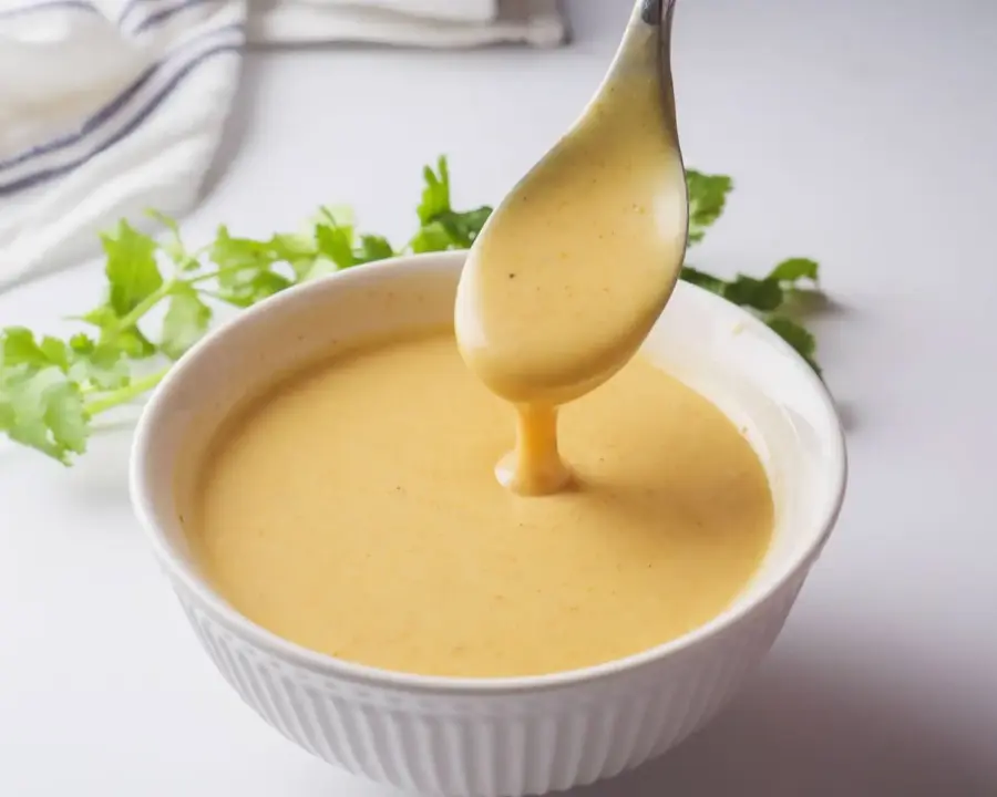 Honey Mustard Sauce Recipe in a serving bowl with a spoon