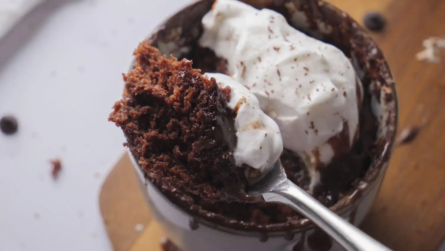 Hot Chocolate Mug Cake in a mug with a spoon