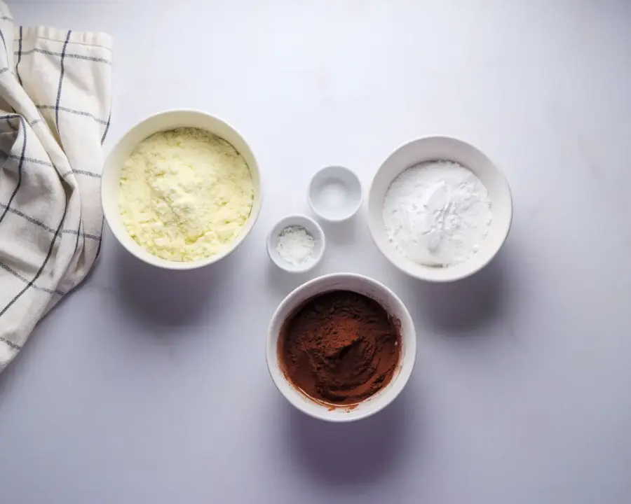 Hot Cocoa Mix Recipe Ingredients on a kitchen countertop