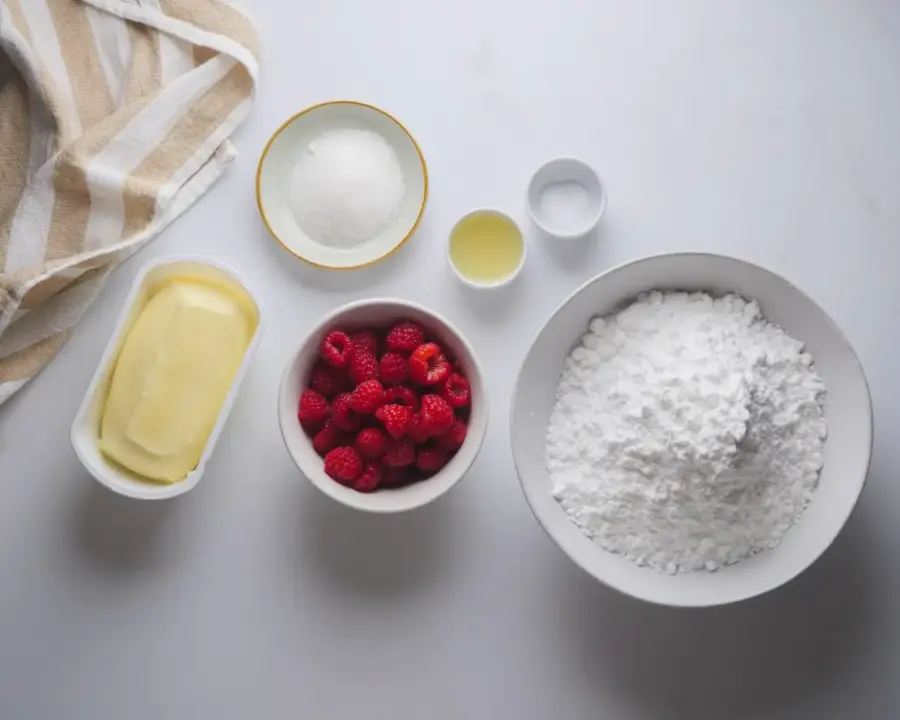 Raspberry Frosting Recipe Ingredients on a kitchen countertop