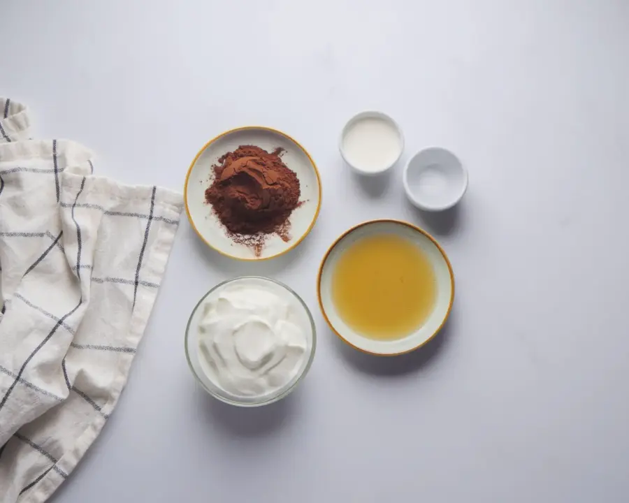 Greek Yogurt Chocolate Pudding Recipe Ingredients on a kitchen countertop