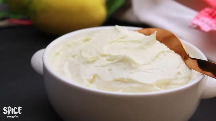 Homemade Cream Cheese in a serving bowl with a spoon